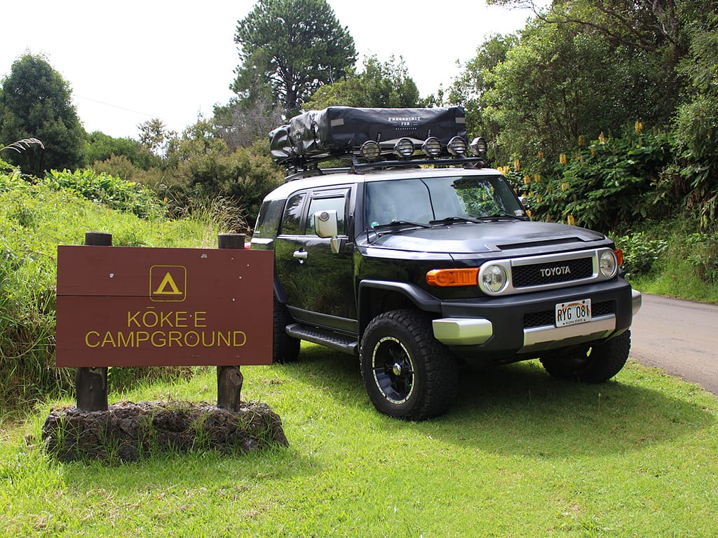 Kokee State Park Campground sign with rooftop camper